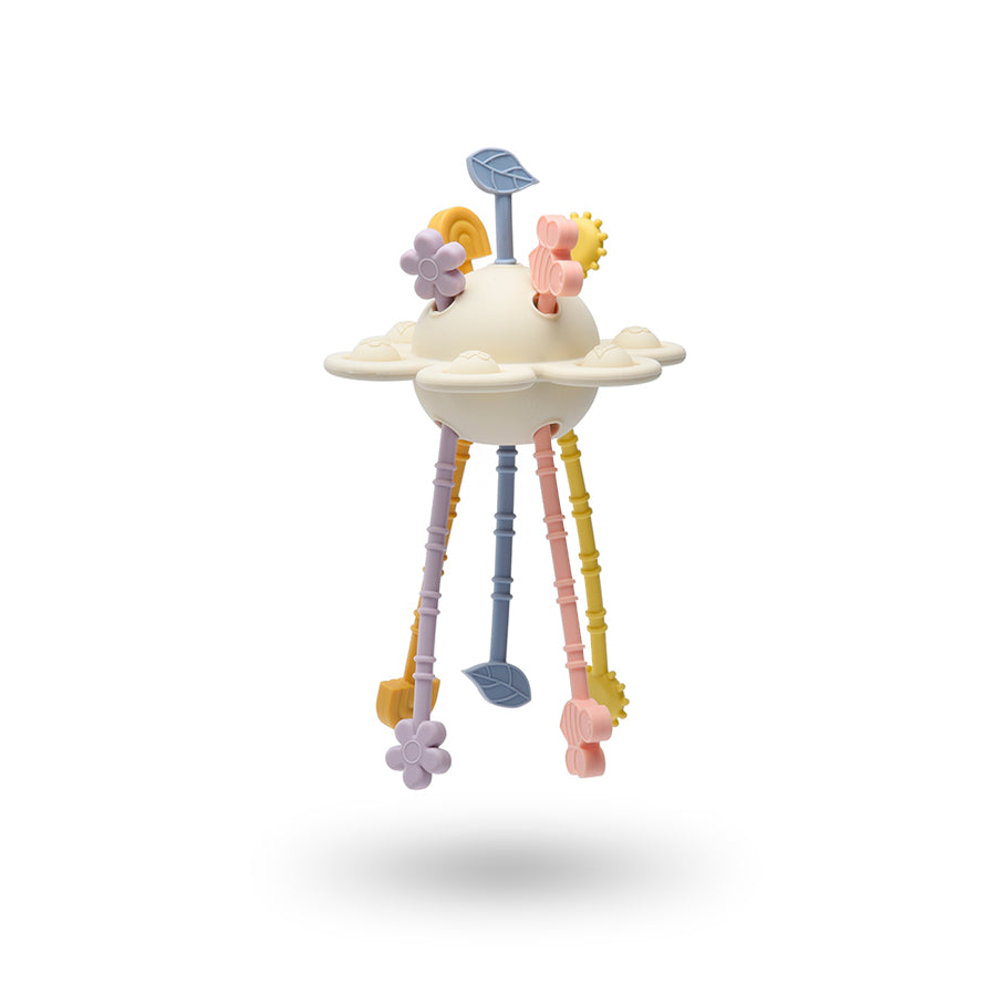 Pastel-colored baby rattle toy on a white background