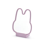 Pink bunny-shaped cookie cutter on a white background