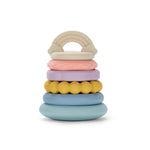 A multicolored silicone stacking teething ring toy consisting of several circular rings in pastel colors stacked on top of each other.