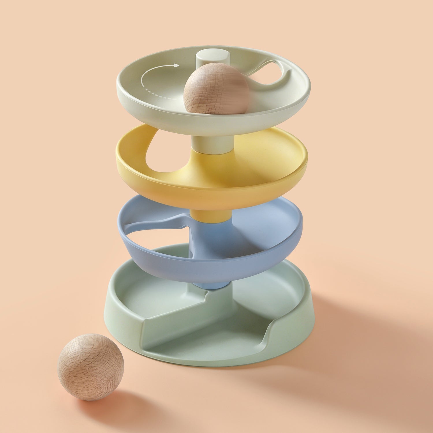 4-tiered baby toy with 2 wooden balls on a beige background