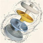 Three interlocking plastic pieces with water splashes on a light background