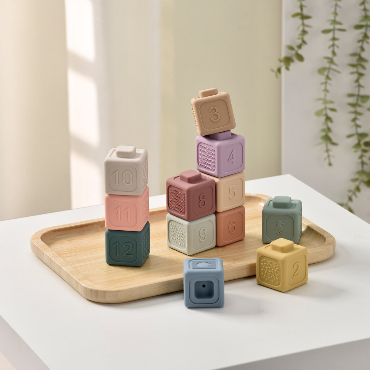 Colorful stacking blocks on a wooden tray with a neutral background