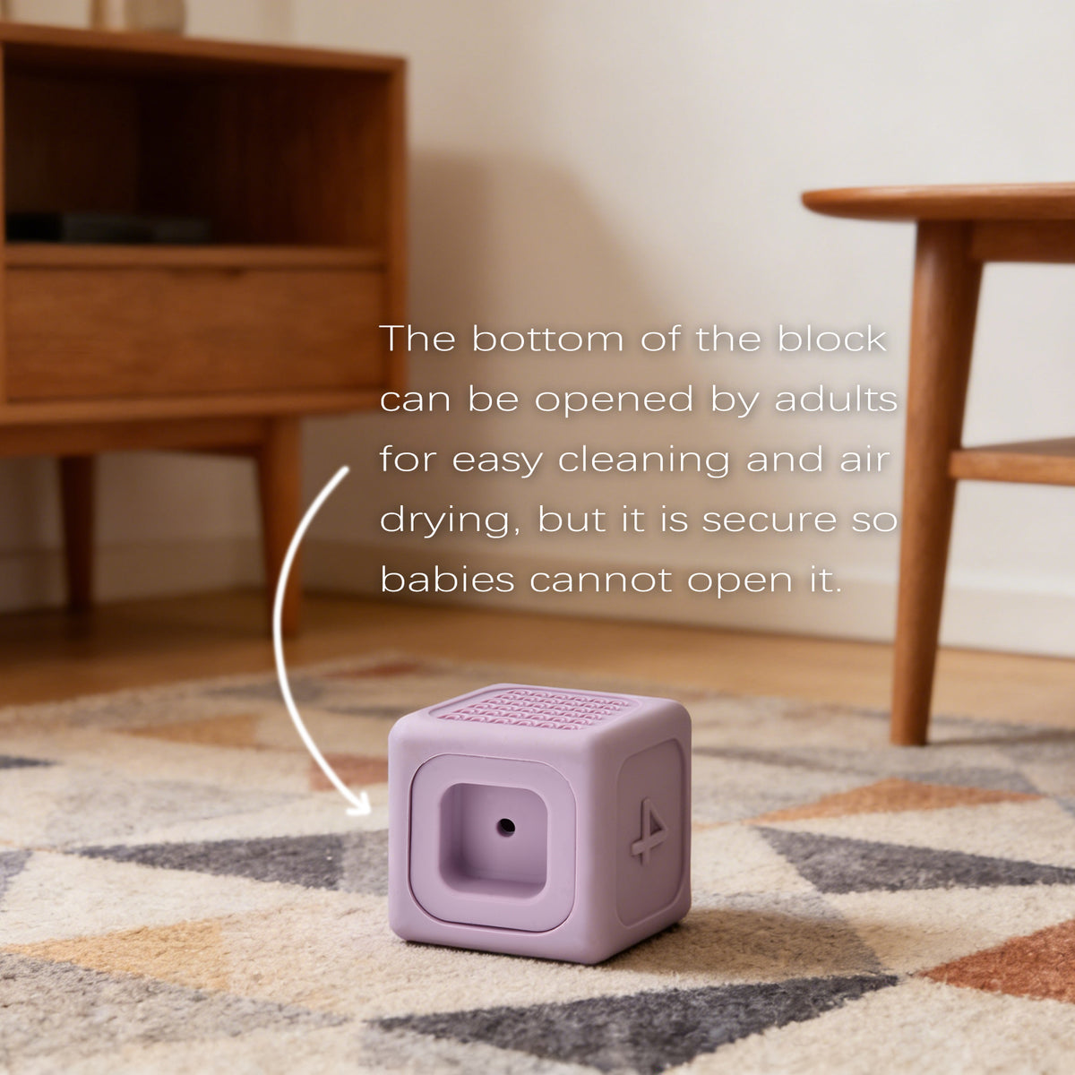 Purple block on a patterned rug with wooden furniture in the background
