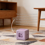 Purple block on a patterned rug with wooden furniture in the background