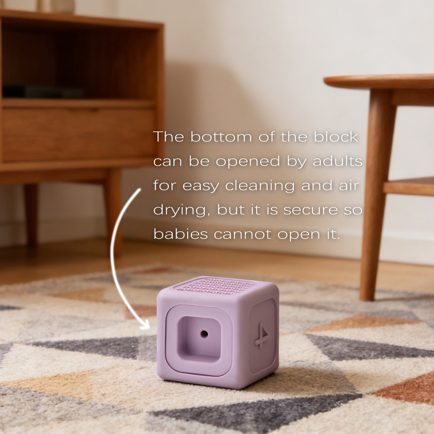 Purple block on a patterned rug with wooden furniture in the background