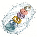 Colorful silicone teething rings with water splashes and 'Easy to Clean' text on a white background 