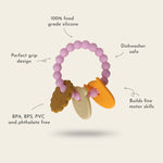 Teething ring with silicone beads and animal charms on a light gray background 
