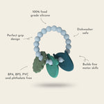 Teething ring with text highlighting features on a light beige background 