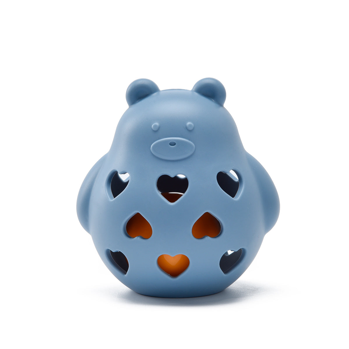 Blue bear-shaped toy with cut-out heart designs on a white background 