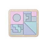 Wooden puzzle with pastel-colored geometric shapes on a white background 