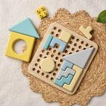 Colorful geometric shape sorting toy on a textured surface 