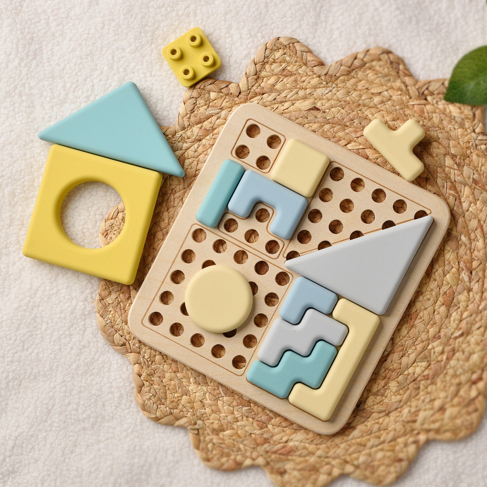 Colorful geometric shape sorting toy on a textured surface 
