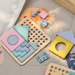 Colorful wooden and silicone geometric shape sorting toy on a soft surface 