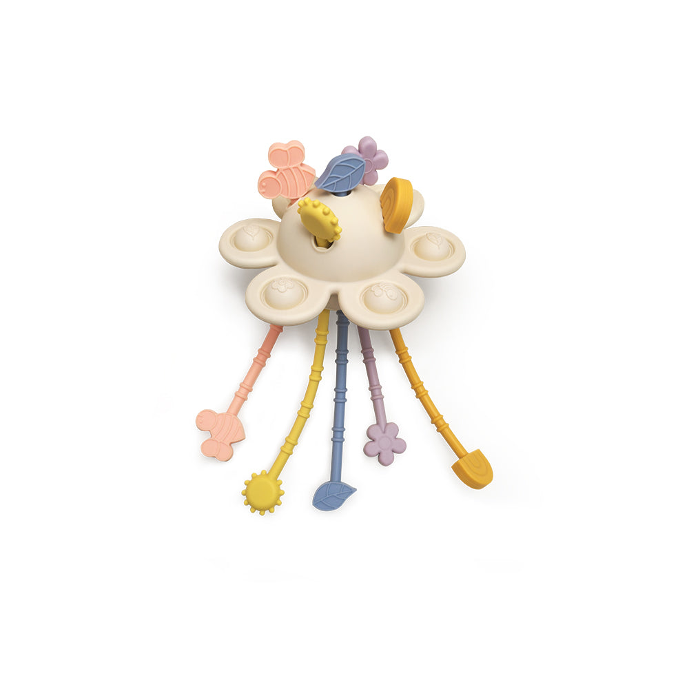 Pastel-colored children's toy with floral design on a white background