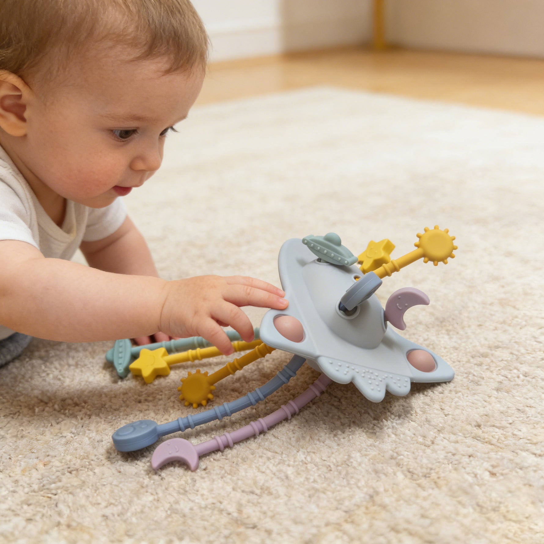 Child playing with a colorful toy on a carpeted floor