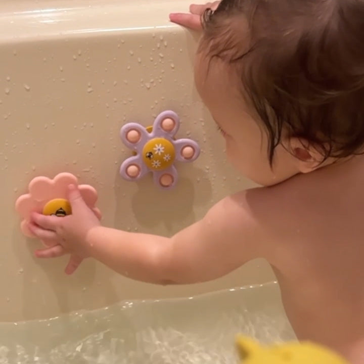 Child playing with bath toys in a bathtub 