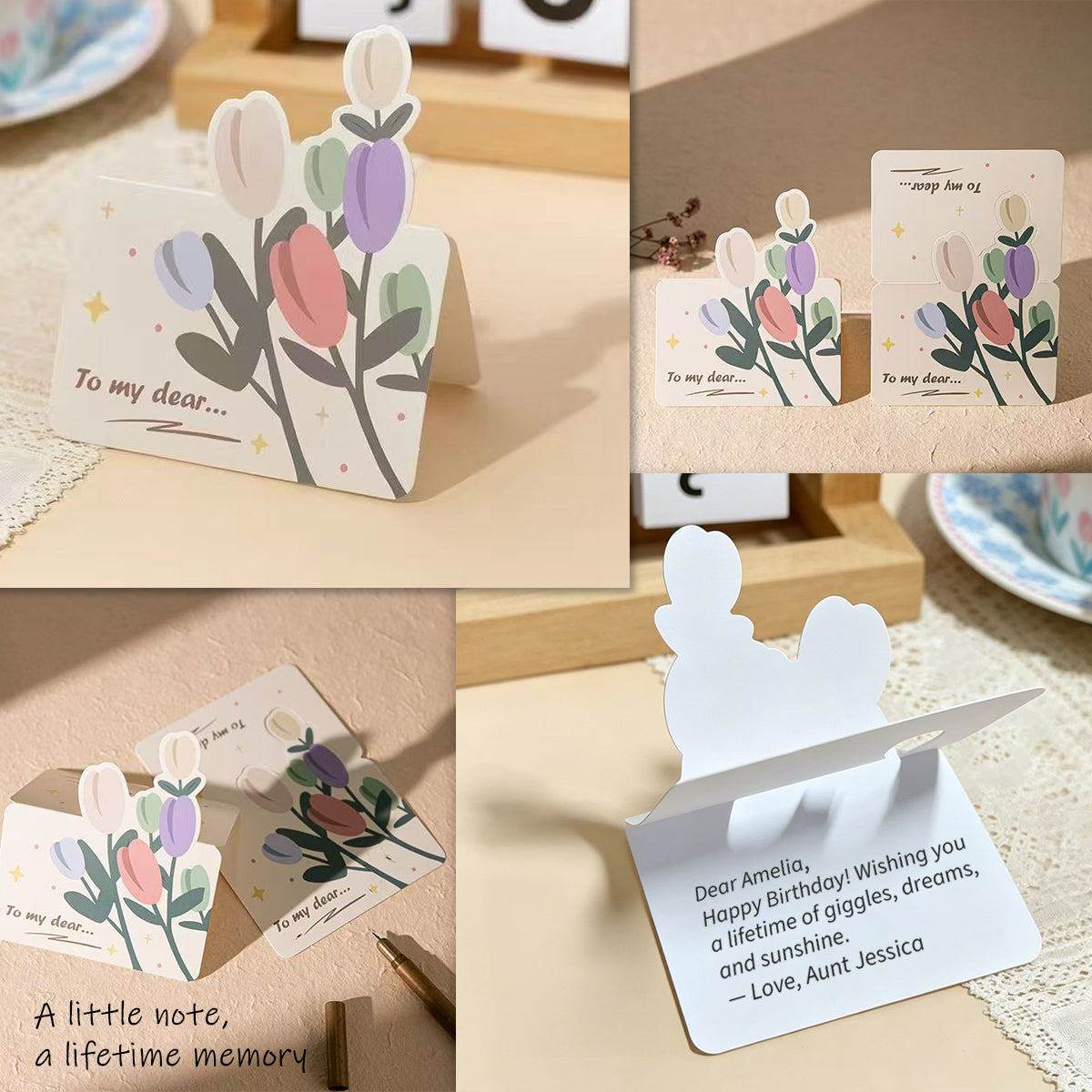Floral-themed greeting cards with stands on a wooden surface.