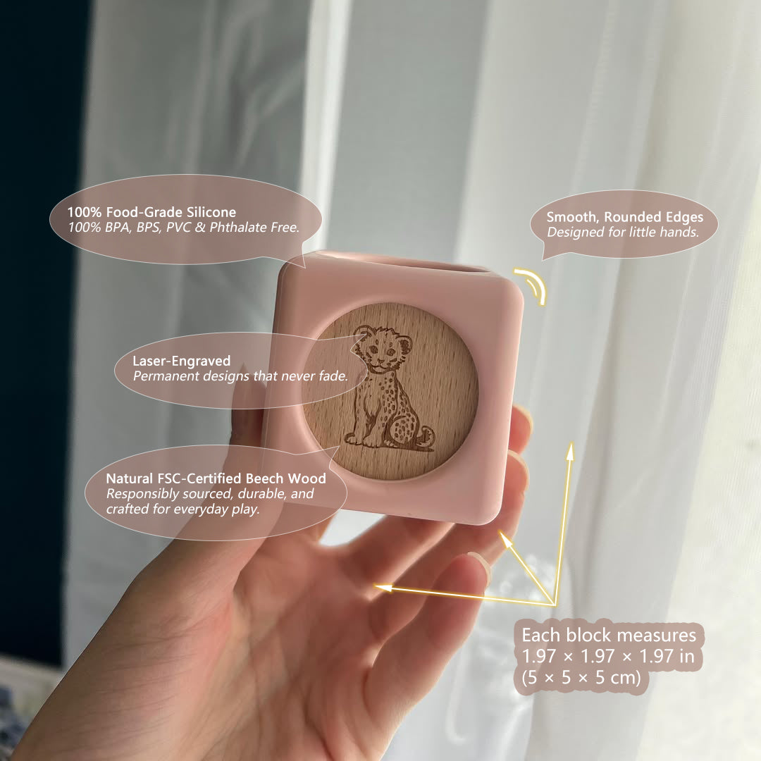 A hand holding a light pink silicone sand block with a natural wood lion engraving, set against a soft-focus background of curtains and a window. Text callouts highlight the product's features and dimensions.