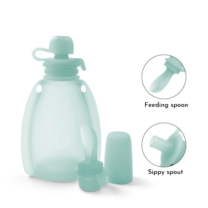 Silicone bottle with feeding spoon and sippy spout on a white background 