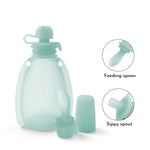Silicone bottle with feeding spoon and sippy spout on a white background 