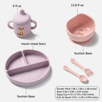 A baby feeding set on a light gray background, including a lavender silicone sippy cup with a fox illustration, a pink suction bowl, a lavender divided plate with hand-inlaid stars, and pink utensils. Text labels identify parts and provide dimensions.