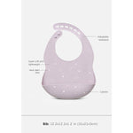 A light purple baby bib with white star details, shown with callout lines and text labels explaining its features, including adjustable neckband, super soft and lightweight, hand-blown stars, and catcher.