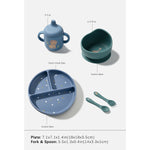 A children's dinnerware set shown on a light gray background with size labels and measurements. The set includes a blue divided plate, a blue sippy cup, a dark teal suction base, and matching teal fork and spoon.