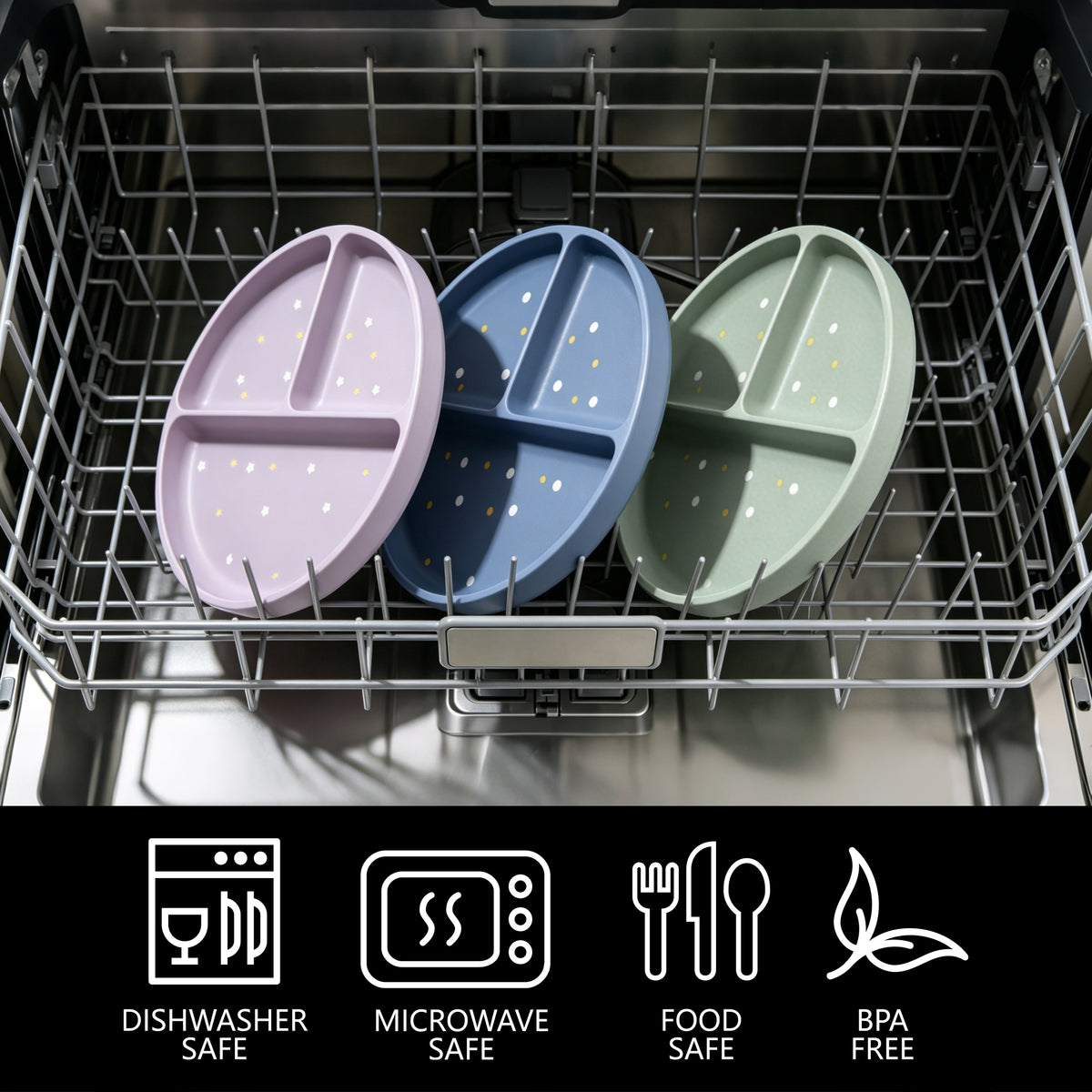 Three oval divided baby plates in pastel purple, blue, and sage green with small white polka dots, shown inside a dishwasher rack. A black banner at the bottom lists dishwasher safe, microwave safe, food safe, and BPA free icons.