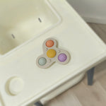 Colorful fidget spinner on a high chair