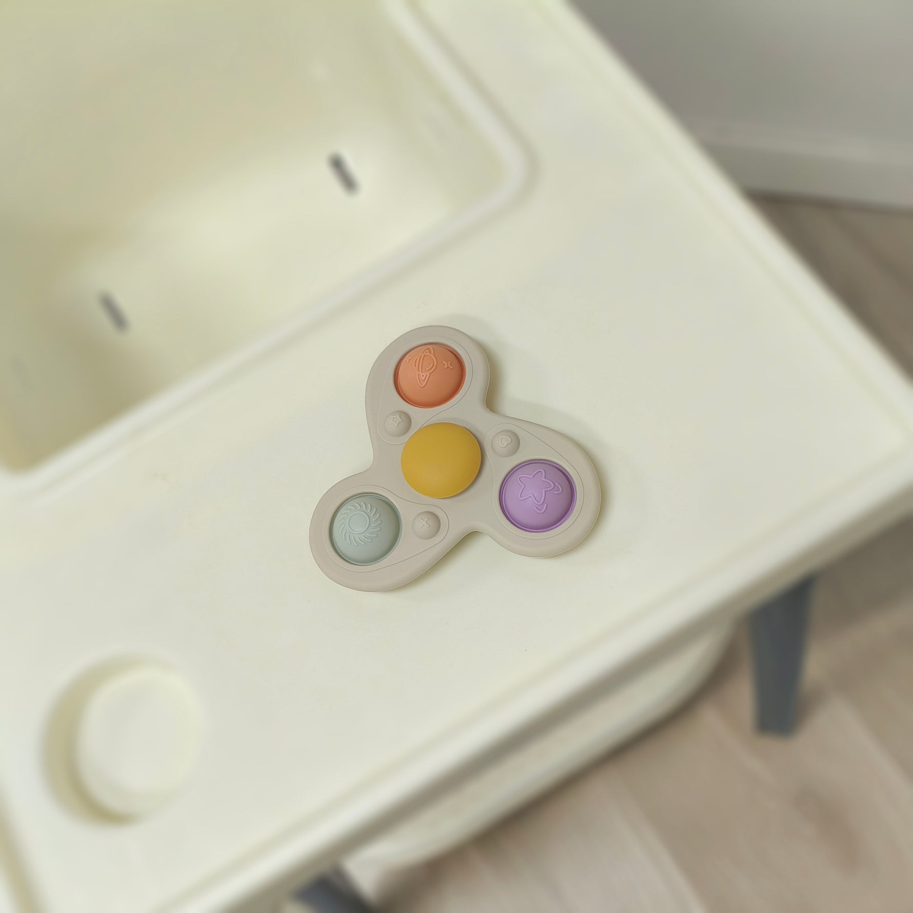 Colorful fidget spinner on a high chair